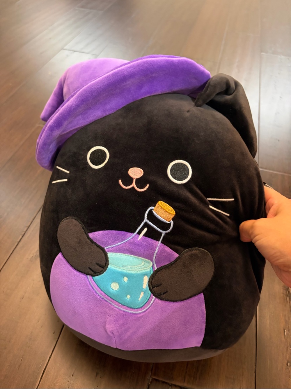New Squishmallows Black & Purple Cat Plush with Potion Bottle